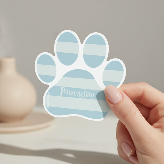 Hand holding a blue striped paw print sticker with 'Pawenclaw' branding.
