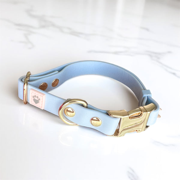 Serenity Blue waterproof dog collar with light gold hardware, made to protect, comfort, and reflect the special bond you share with your dog.