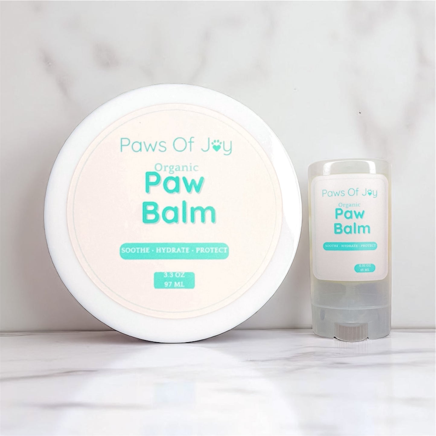 Organic paw balm bundle with full-size and travel-size jars, made with love to protect and soothe your dog’s precious paws wherever life takes you.