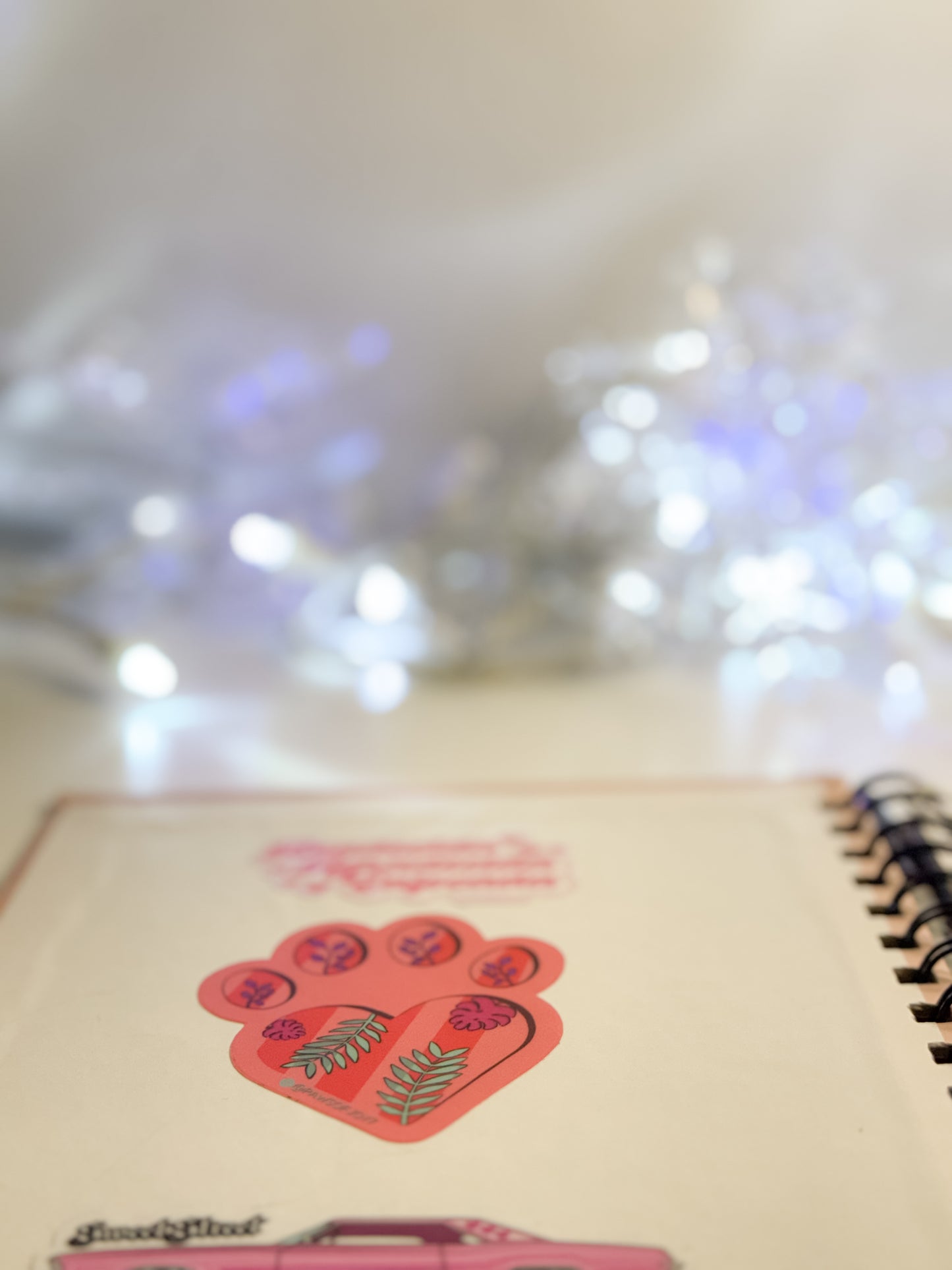 Notebook with decorative stickers on a blurred background